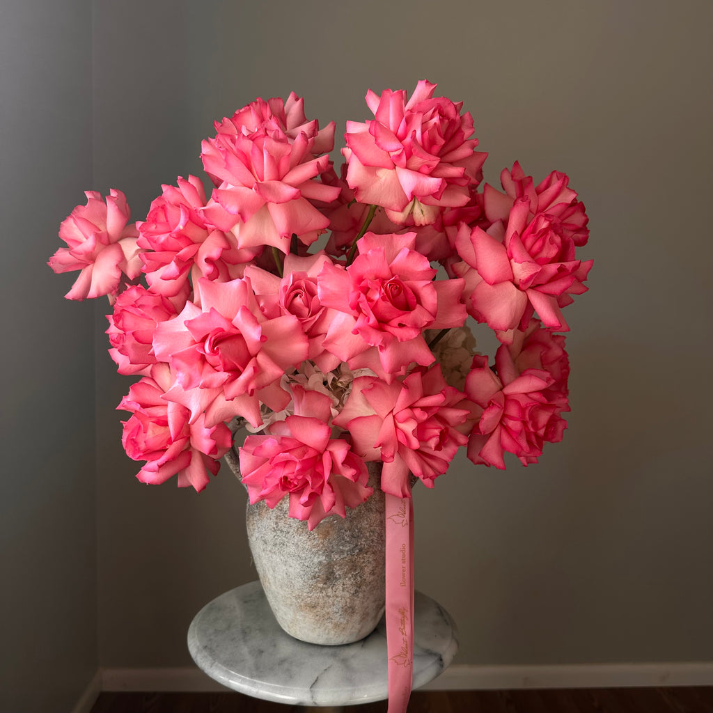 Bouquet of pink flowers in a vase.