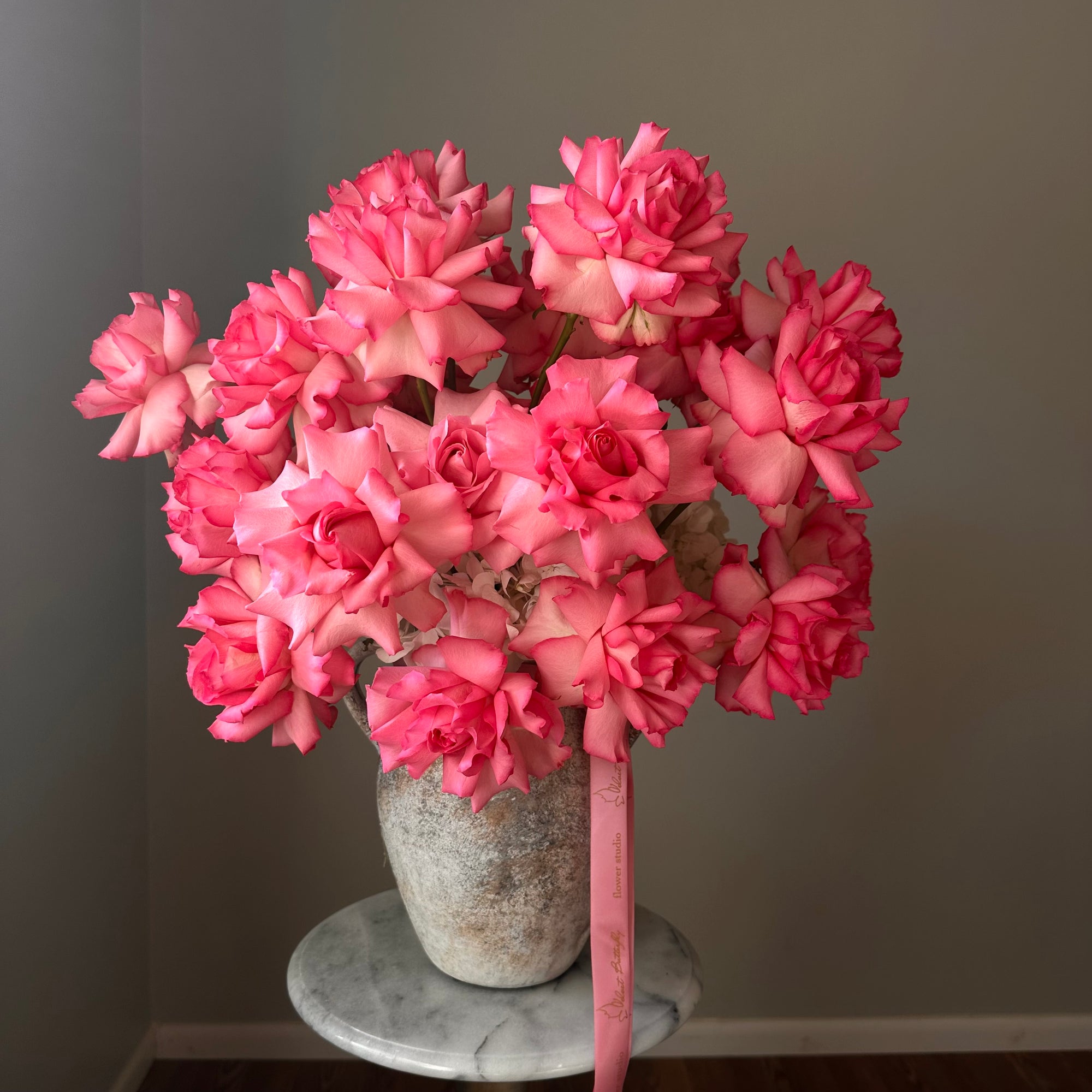 Bouquet of pink flowers in a vase.